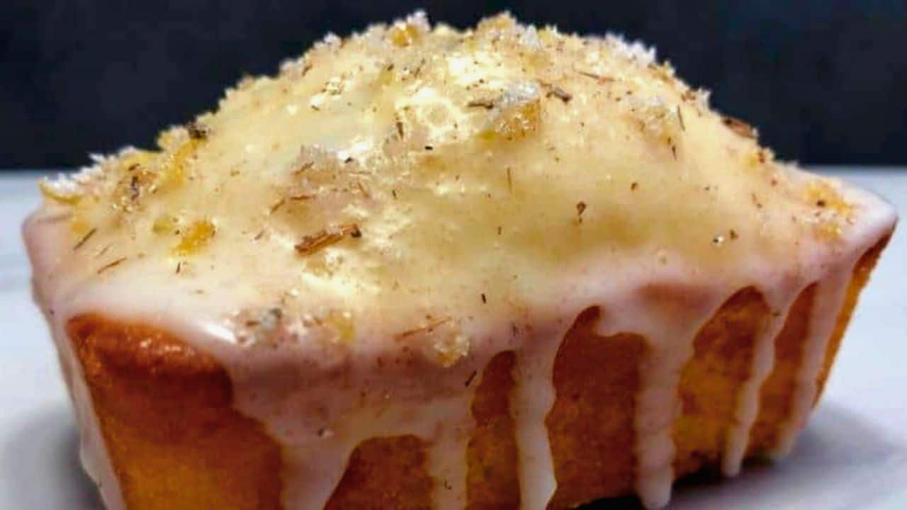Butter cake topped with lemon glaze and shredded coconut for a sweet treat.
