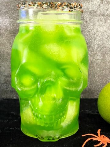 green martini in a skull glass.