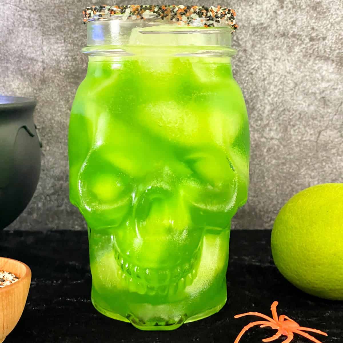green martini in a skull glass.